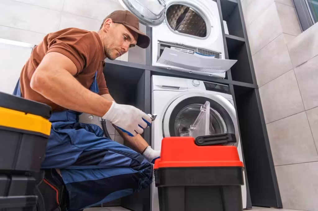Handyman Repairing a Washing Machine